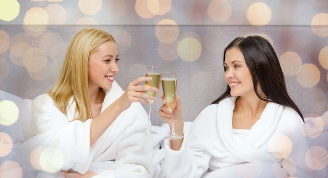Friends enjoying a spa break with a glass of prosecco