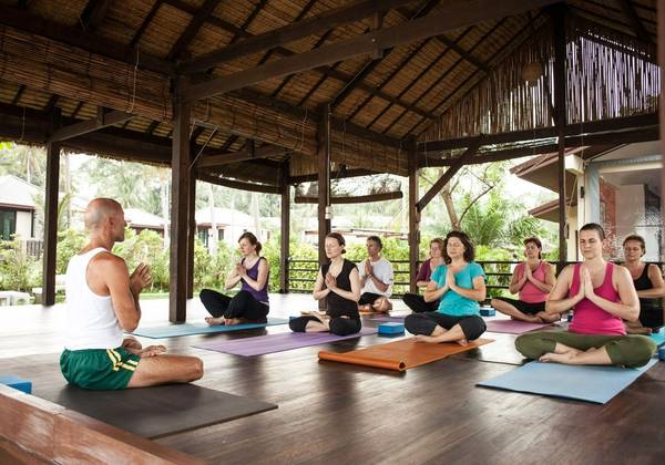 Group yoga class on a retreat