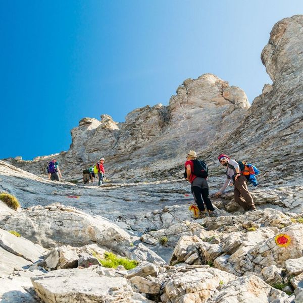 Hikers at the summit of Kilimanjaro, Uhuru Peak, holding up an EverTrek banner