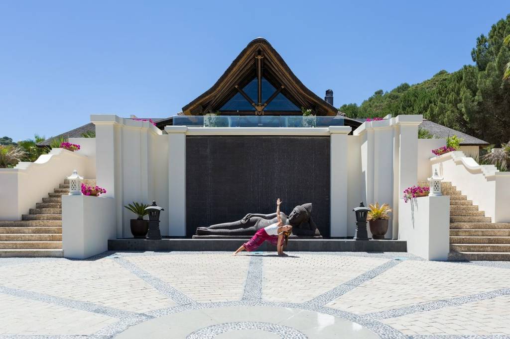 Woman practicing yoga at Shanti Som