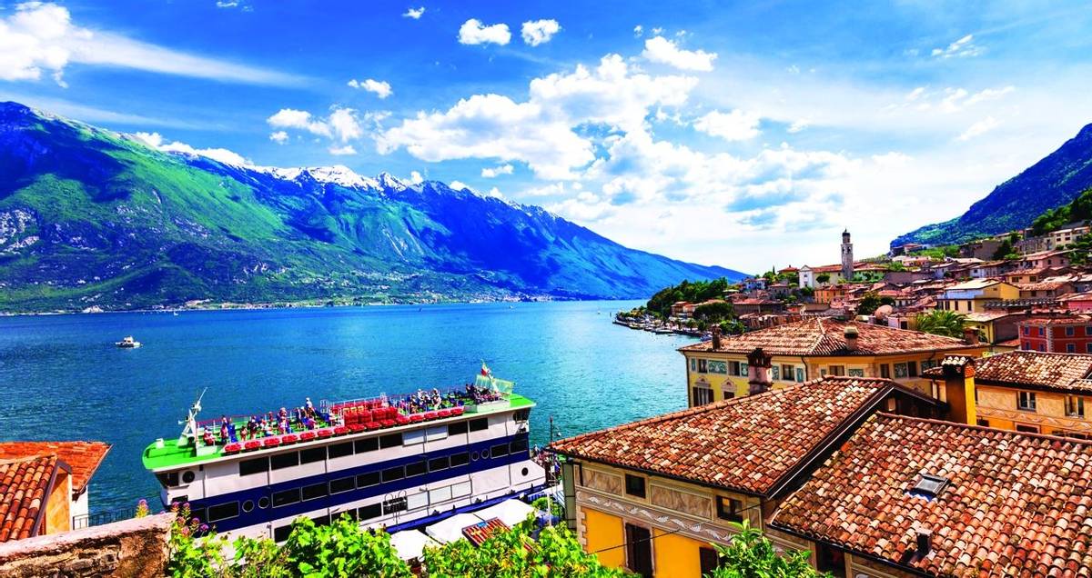 Amazing scenery of Lado di Garda, cruise boat in Limine town. Italy