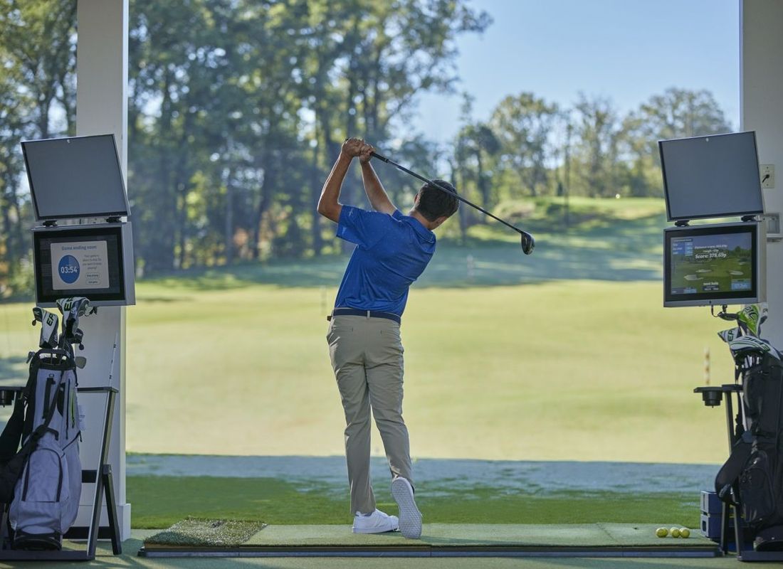 Man using Toptracer Range Facility Golf Driving Range at Old Thorns 