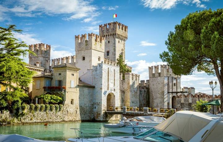 Sirmione, Italy - July 16, 2014: Rocca Scaligera castle in Sirmione town near Garda Lake in Italy