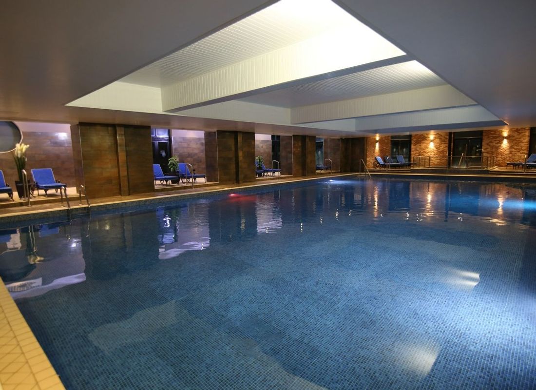 Hotel indoor swimming pool at night