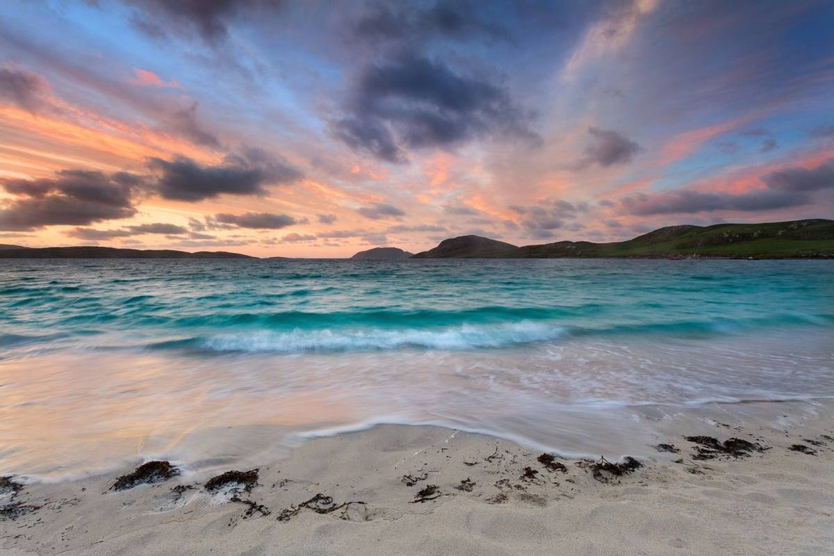 Stunning sunrise over Vatersay beach, Outer Hebrides .