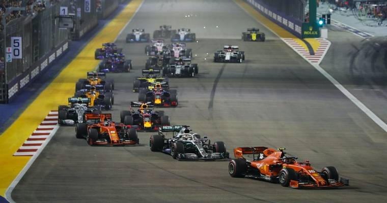 SINGAPORE STREET CIRCUIT, SINGAPORE - SEPTEMBER 22: Charles Leclerc, Ferrari SF90, leads Lewis Hamilton, Mercedes AMG F1 W10…