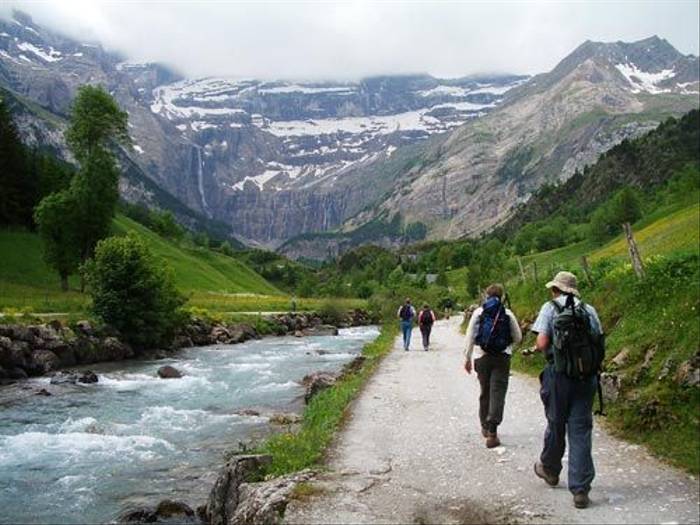 Group walking through river valley
