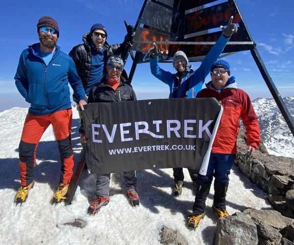 At the summit of Mt Toubkal on a trek with EverTrek