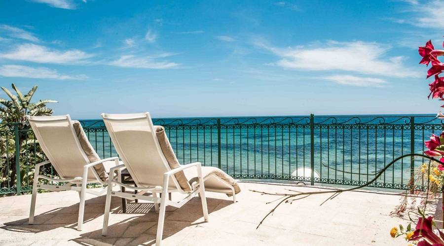 Deckchairs at Forte Village looking out onto the sea