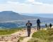 Walkers Descending Whernside in the Yorkshire Dales, England, with a view of Ingleborough