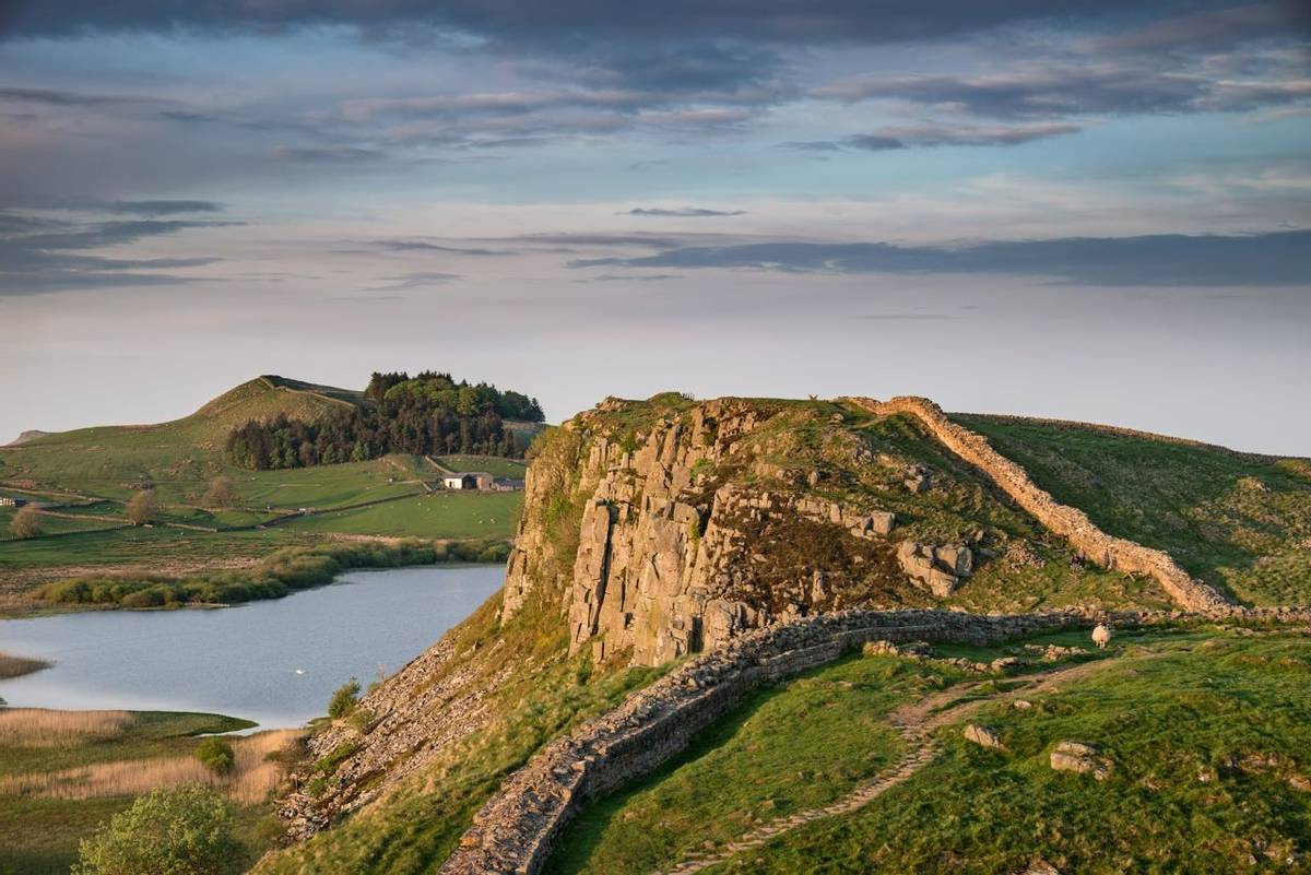 Beautiful landscape image of Hadrian's Wall in Northumberland at sunset with fantastic late Spring light
