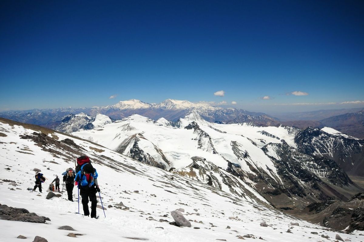 A contingent of climbers trudge their way up the slopes of Mt. Aconcagua.