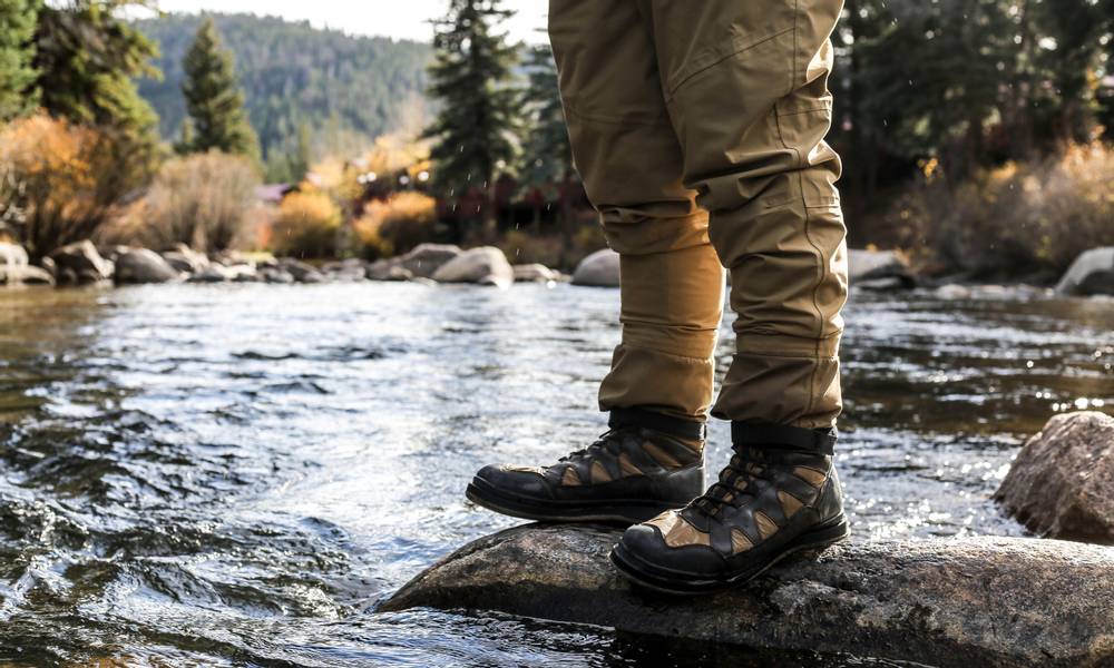 Wearing waterproof hiking boots on river