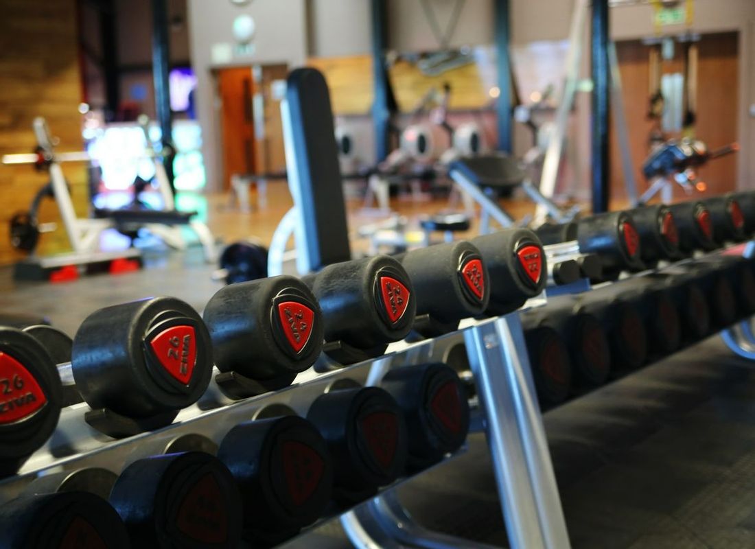 Free weights stacked on rack inside the health club and gym