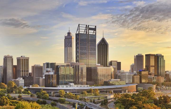 Perth city CBD towers close up view from lookout of Kings park at sunrise during gold sun light hour. Perth city CBD towers close up view from lookout of Kings park at sunrise during gold sun light hour.