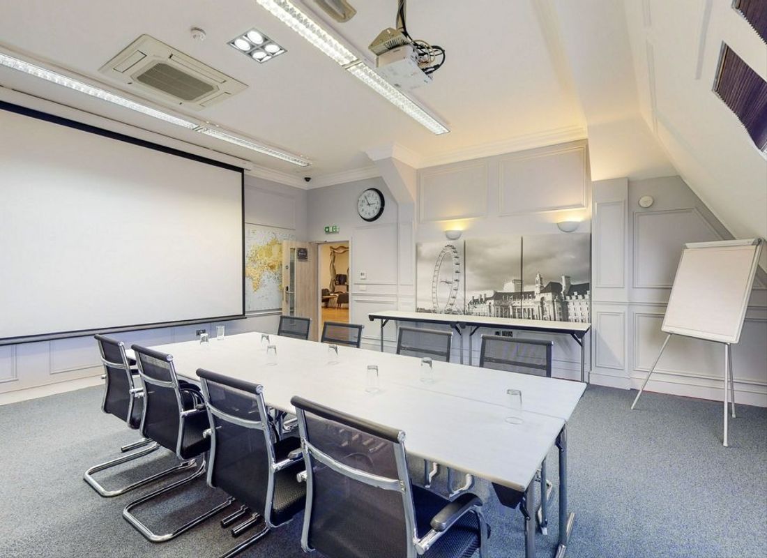Large meeting room with projector and paper chart