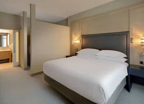 Embassy Suites by Hilton St. Augustine Beach Oceanfront Resort suite + bed.jpg