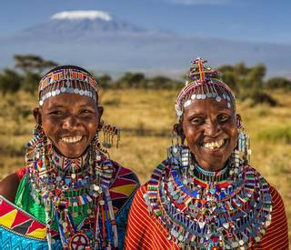 Portrait of happy African women from Masai tribe, Kenya, Africa. Mount Kilimanjaro on the background, central Kenya, Africa.…