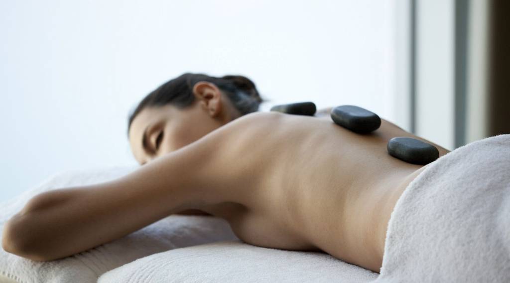 Woman having a hot stone massage at Vilalara Longevity Thalassa and Medical Spa
