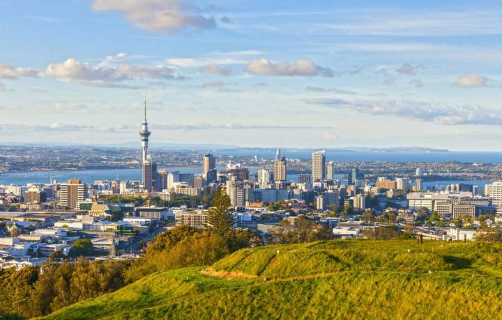 Auckland, New Zealand, from the volcano Mount Eden, the crater rim is in the foreground.