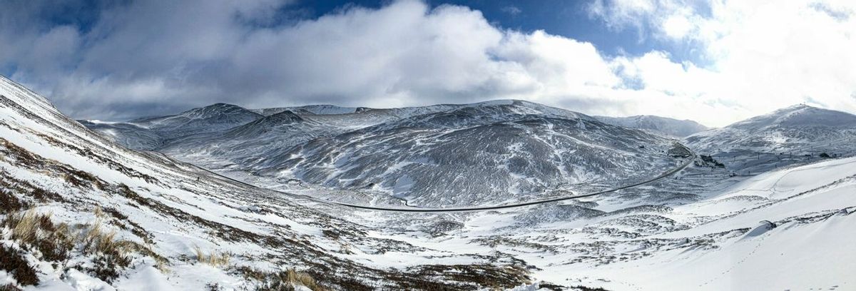Scottish snowy mountain landscape. Cairngorms National Park, Scotland..