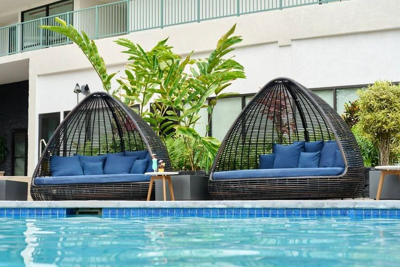 Outrigger Kona Resort & Spa Pool loungers.jpg