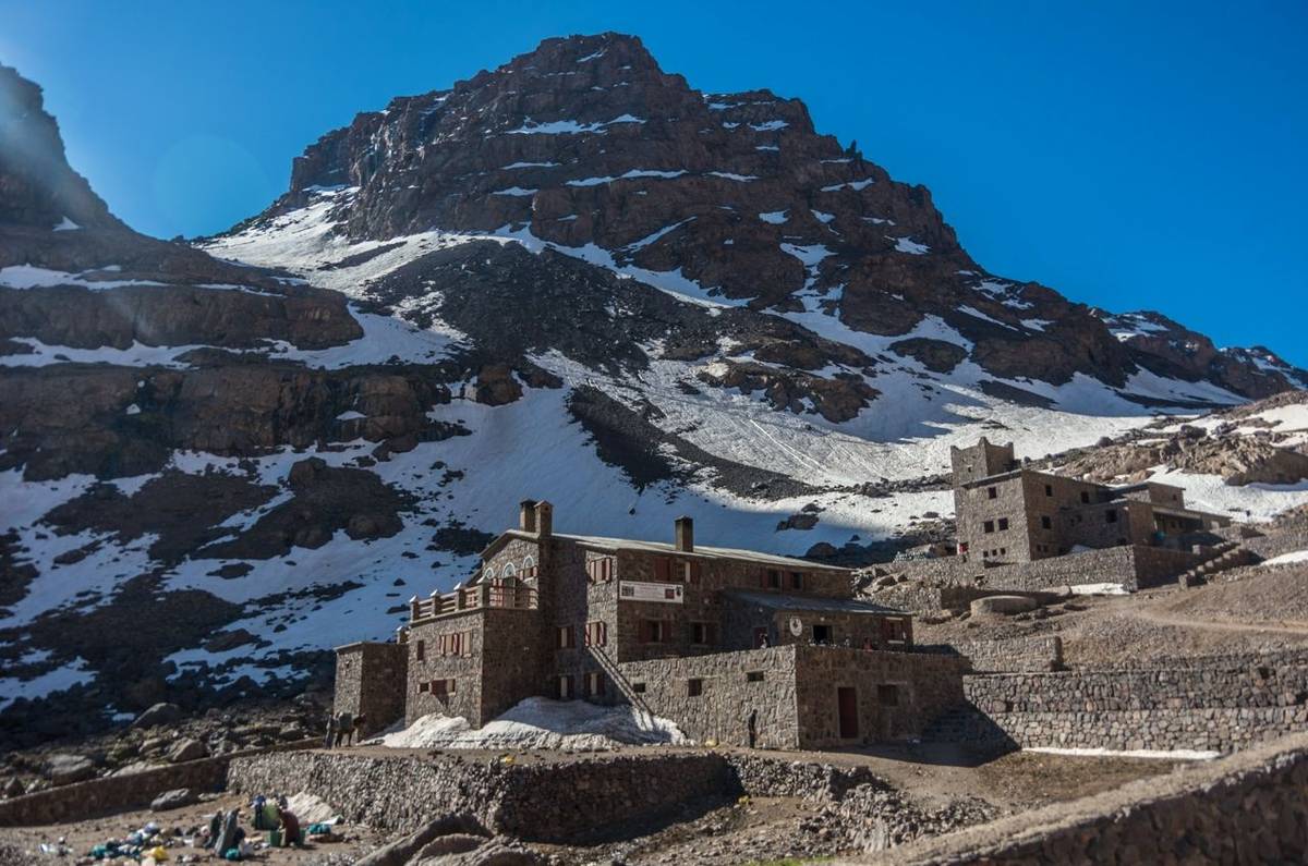 Toubkal national park in springtime with mount, cover by snow and ice, Refuge Toubkal, start point for hike to Jebel Toubkal…