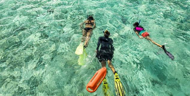 Go snorkelling as a family at COMO Maalifushi in the Maldives
