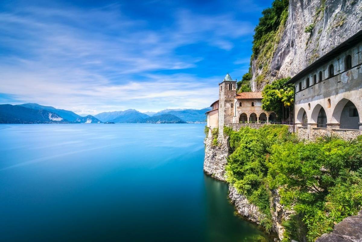 Hermitage or Eremo of Santa Caterina del Sasso medieval roman catholic monastery. Leggiuno Maggiore lake, Lombardy Italy, Eu…