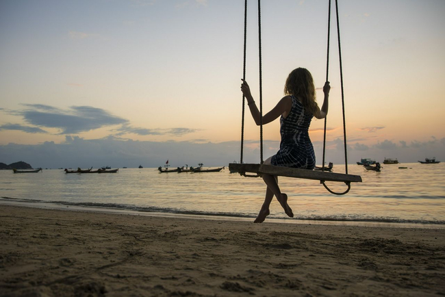 Woman on a Swing on the Beach
