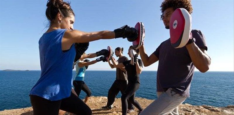 One-on-one kickboxing session on the beach