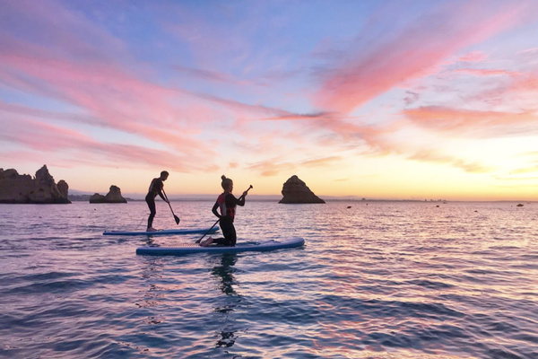 Sunset stand up paddle boarding at Workout Away