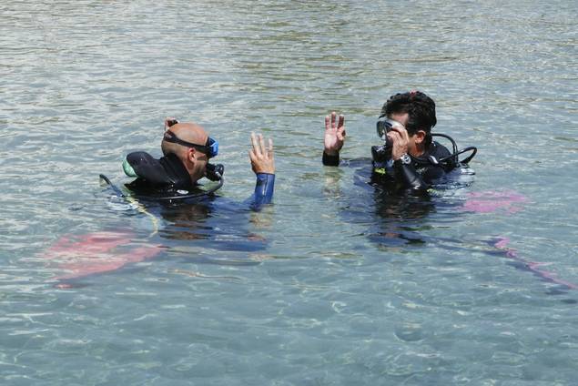 Two men scuba diving at P.to Elounda