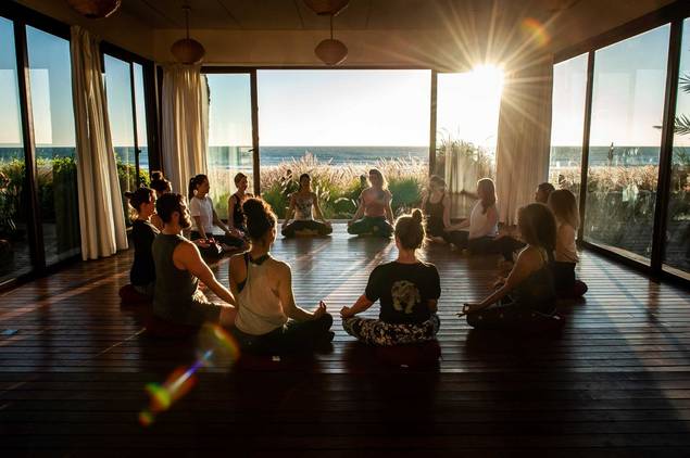 Group yoga at Paradis Plage